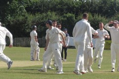 Barrow-Gurney-players-celebrate-an-early-wicket-at-Frenchay